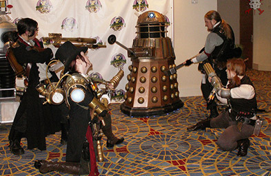 Picture of steampunk cosplayers fighting a Dalek